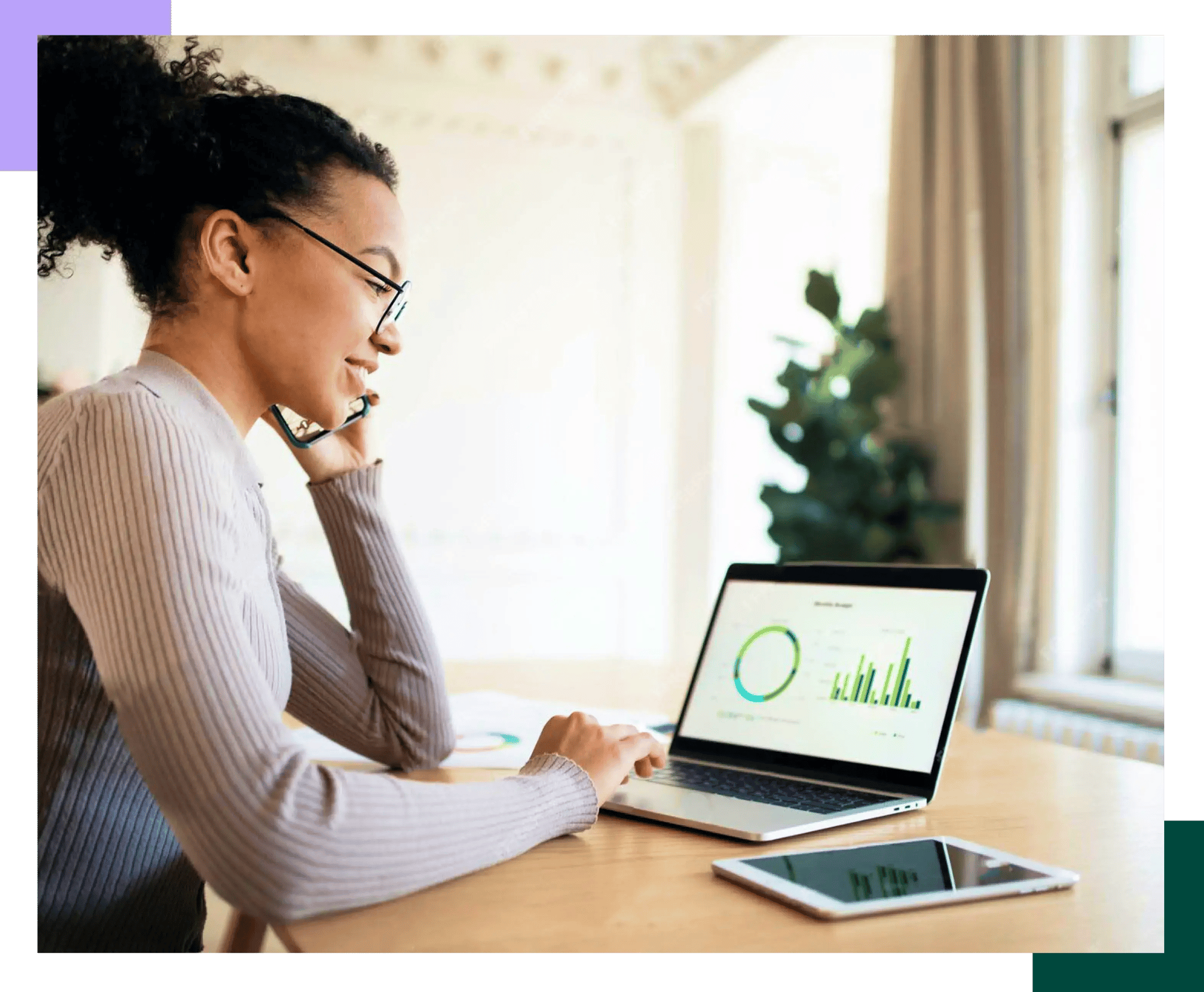 Young black woman checking her finances on her laptop at home