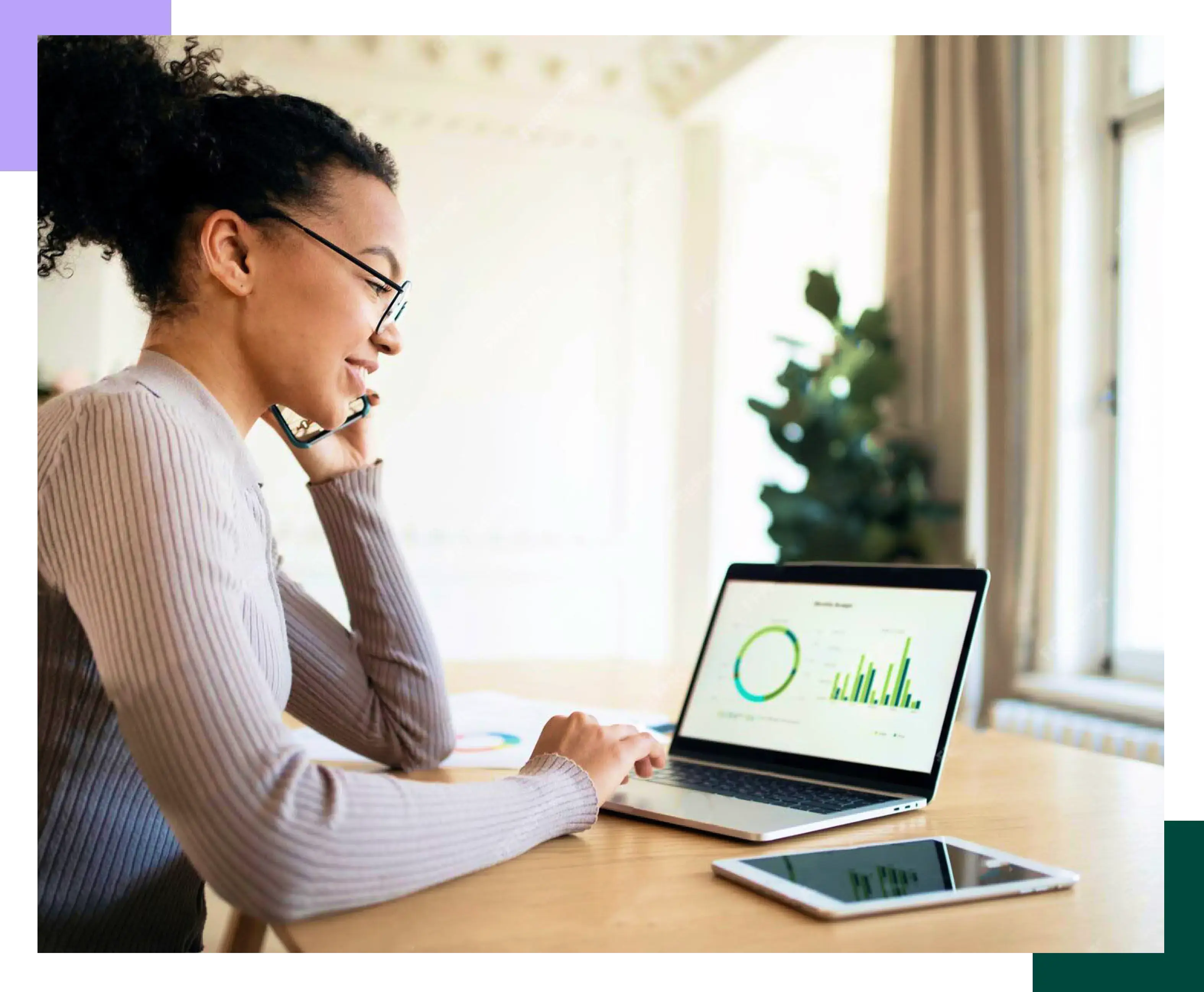 Young black woman checking her finances on her laptop at home